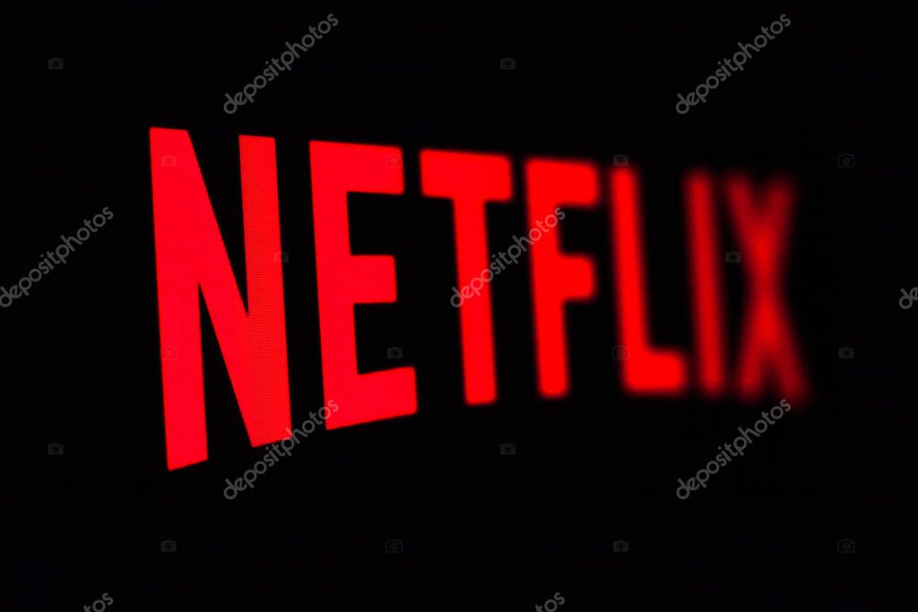 Kyiv, Ukraine -  March 9, 2021: Netflix logo on the screen. Netflix is an American content platform and production company offering online streaming service from a library of films and TV series.