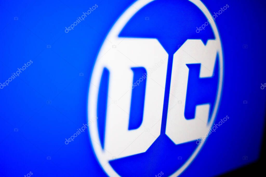Kyiv, Ukraine -  March 9, 2021: DC logo on the screen. Famous American comic book publisher and the flagship unit of DC Entertainment.