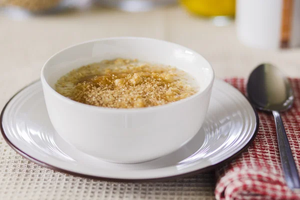 Bowl of porridge with golden topping — Stock Photo, Image