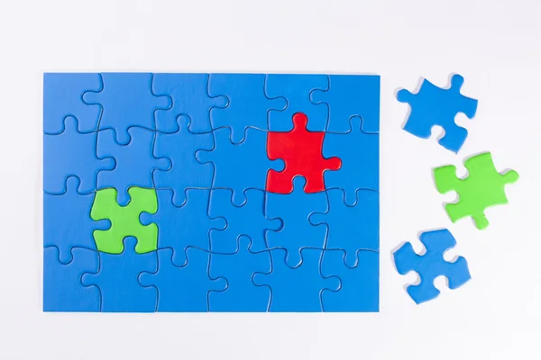 Jigsaw puzzle with colored pieces signifying diversity and equal — Stock Photo, Image