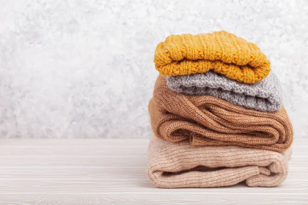 Pile of warm knitted clothes copy space — Stock Photo, Image