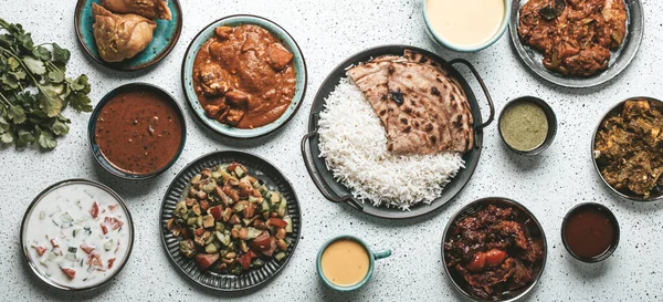 Indian ethnic food buffet on white concrete table from above — Stock Photo, Image