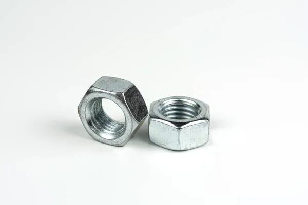 Small Group Silver Fasteners Secure Structure Nuts Close White Background — Foto Stock