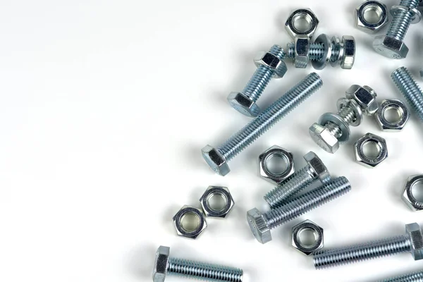 Several Bolts Nuts Made Silver Metal Close Isolated White Background — Stok fotoğraf