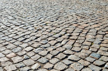 Soyut arkaplan. Şehir parkında granit taşlardan yapılmış asfalt.