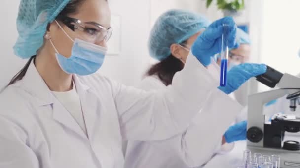 Group of laboratory assistants training in the laboratory — Stock Video