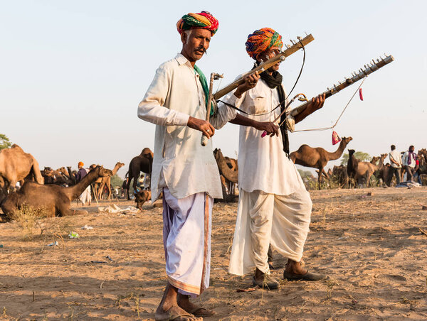 PUSHKAR, RAJASTHAN / INDIA - Local people at Pushkar Camel Fair ground 