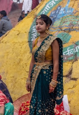 Ghaziabad, Uttar Pradesh, India - November 2021: Chhath Puja, Indian hindu devotees performing rituals of chhath puja in the night near river bank.