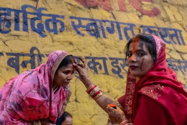 Ghaziabad, Uttar Pradesh, India - November 2021: Chhath Puja, Indian hindu devotees performing rituals of chhath puja in the night near river bank.