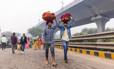 Ghaziabad, Uttar Pradesh, India - November 2021: Chhath Puja, Indian hindu devotees performing rituals of chhath puja in the night near river bank.
