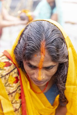 Ghaziabad, Uttar Pradesh, India - November 2021: Chhath Puja, Indian hindu devotees performing rituals of chhath puja in the night near river bank.
