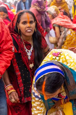 Ghaziabad, Uttar Pradesh, India - November 2021: Chhath Puja, Indian hindu devotees performing rituals of chhath puja in the night near river bank.