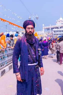 Anandpur Sahib, Punjab, India - March 2022: Portrait of sikh male (Nihang Sardar) during the celebration of Hola Mohalla at Anandpur Sahib on holi festival.