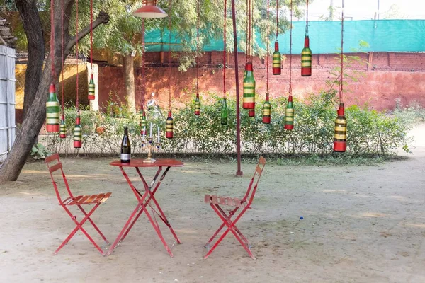 table with wine and chairs in the park