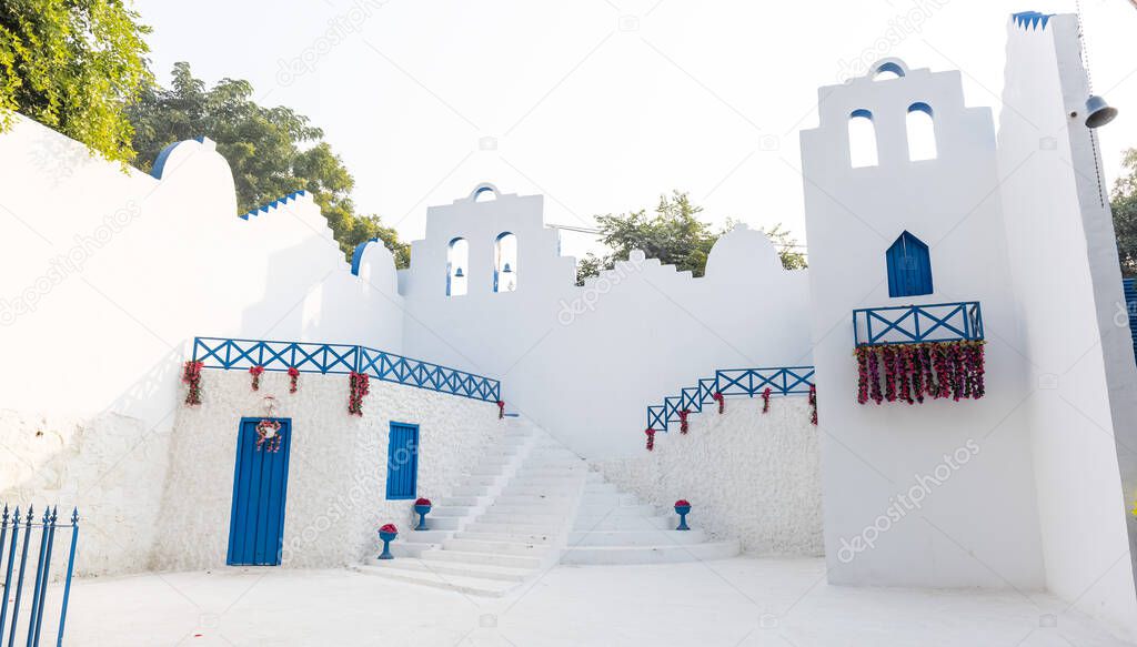 Architectural view of a castle painted with white and blue color.