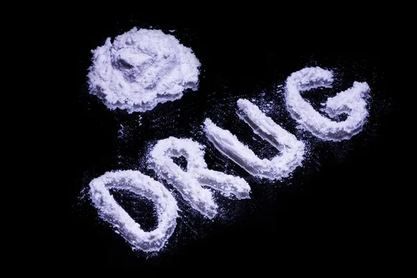 Wortdroge und ein Haufen weißer Drogen — Stockfoto