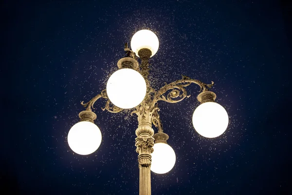 Old street lamp with mosquitoes