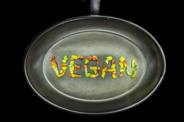 Vegan word on a pan — Stock Photo, Image
