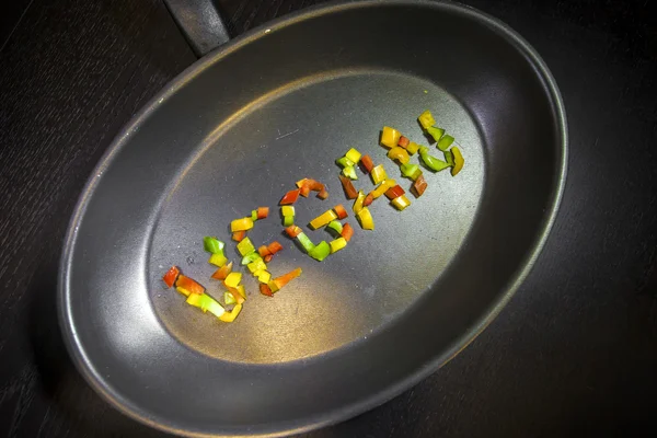 Vegan word on a pan — Stock Photo, Image