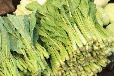 Yeşil, Asya taze yiyeceklerine sebze bırakır..