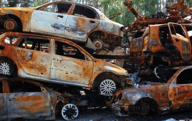Irpin, a lot of burnt shelled cars in the parking lot, the consequences of the invasion of the Russian army in Ukraine. War in Ukraine