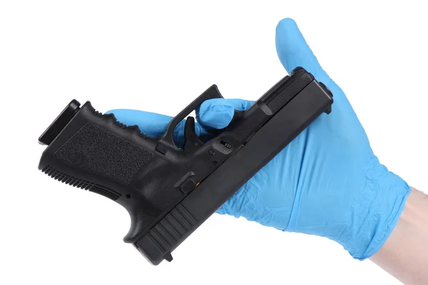 Hand in blue glove keeps handgun as evidence — Stock Photo, Image