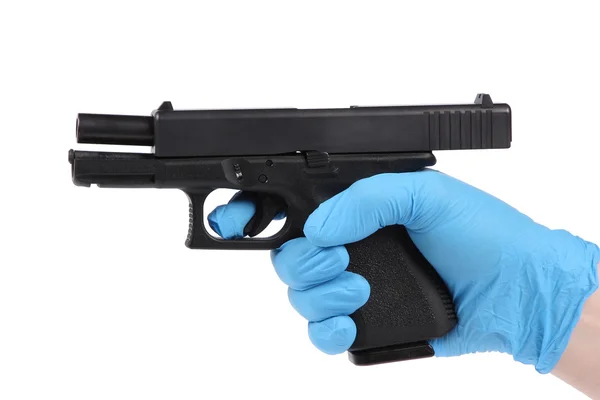 Hand in blue glove keeps handgun as evidence — Stock Photo, Image