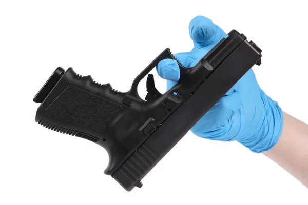 Hand in blue glove keeps handgun as evidence — Stock Photo, Image