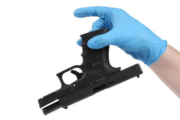 Hand in blue glove keeps handgun as evidence — Stock Photo, Image