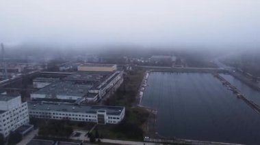 Aerial view from a drone to a thermal power plant in cloudy foggy weather