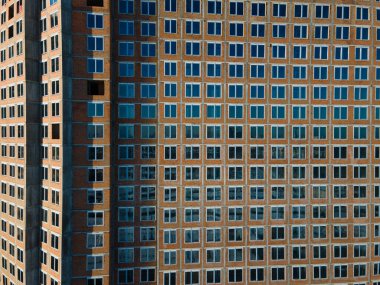 Aerial view from a drone to a pattern from the windows of an unfinished building