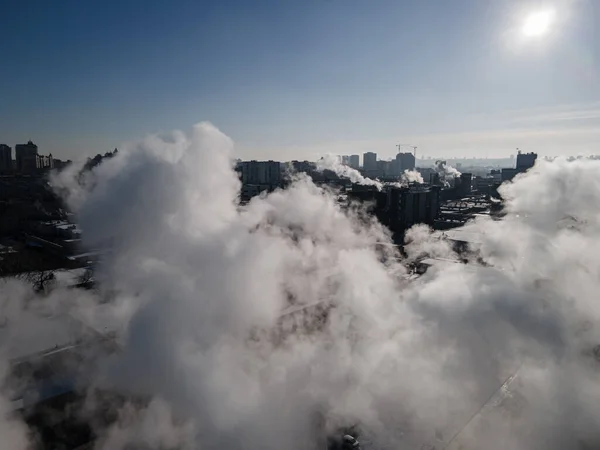 Aerial view from a drone to the factory and to air pollution in the city — Stock Photo, Image