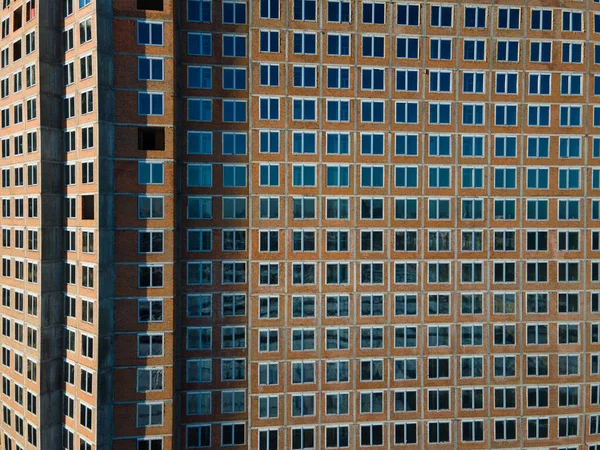 Aerial view from a drone to a pattern from the windows of an unfinished building — Stock Photo, Image