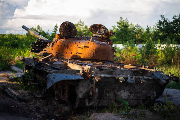 The destroyed and burned modern tank of the russian army in Ukraine in the war in 2022