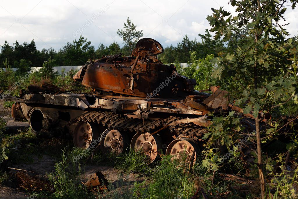 The destroyed and burned modern tank of the russian army in Ukraine in the war in 2022