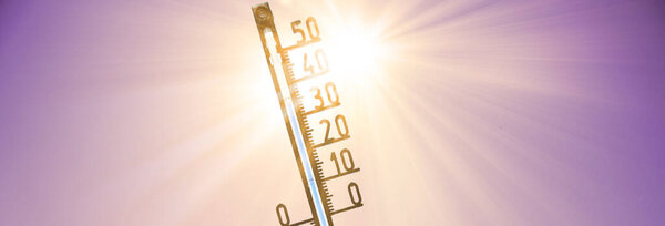 Mercury thermometer. Summer heat or global warming climate change concept.