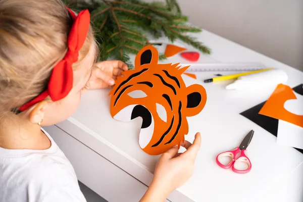 Little Girl Christmas Hat Makes New Year Tiger Mask Colored — Stock Photo, Image