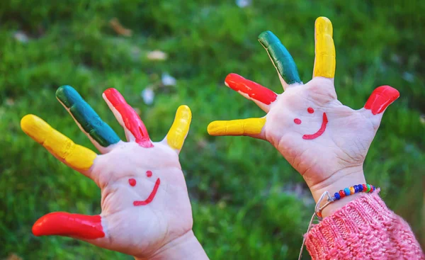 children hands in colors. Summer photo. Selective focus. nature