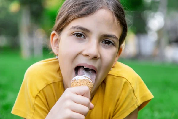 children eat ice cream in the park.selective focus.kids