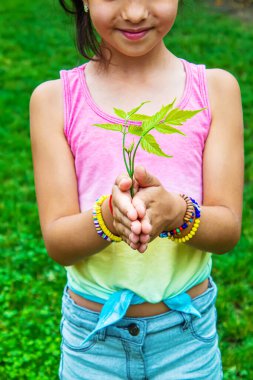 Children take care of nature tree in their hands. Selective focus. nature