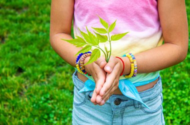 Children take care of nature tree in their hands. Selective focus. nature