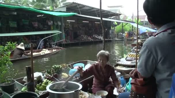 Woman preparing food in a boat — Stock Video