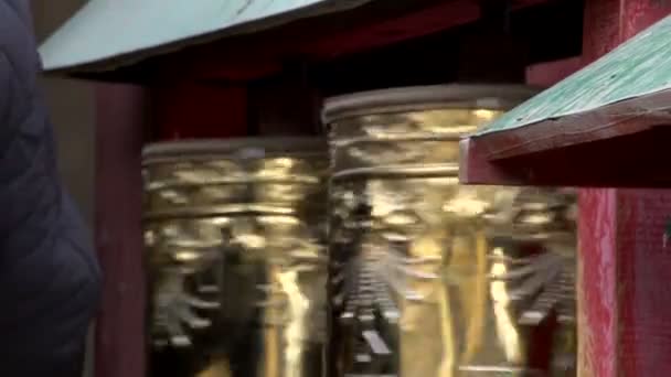 Hand touching the prayer wheels near the Gandan Monastery — Stock Video