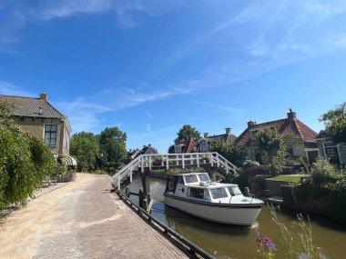 Boat passing by in Kimswerd Friesland the Netherlands