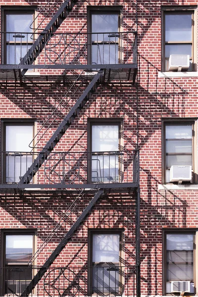 Red Brick Bronx Building Black Metal Fire Escape Shadow Background — Stock Photo, Image