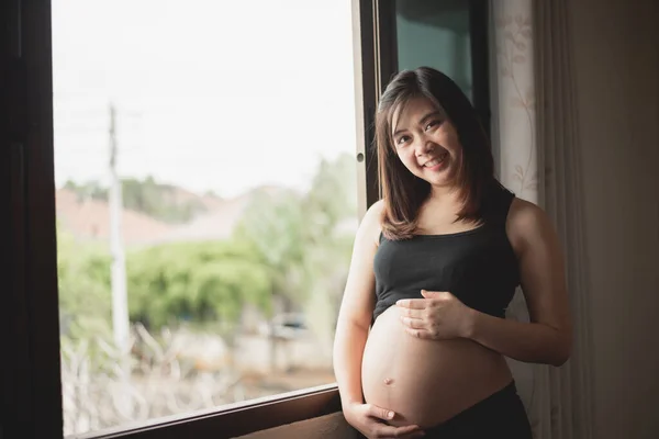 Asian Pregnant Woman Holds Her Hands Her Swollen Belly Pregnant — Stockfoto