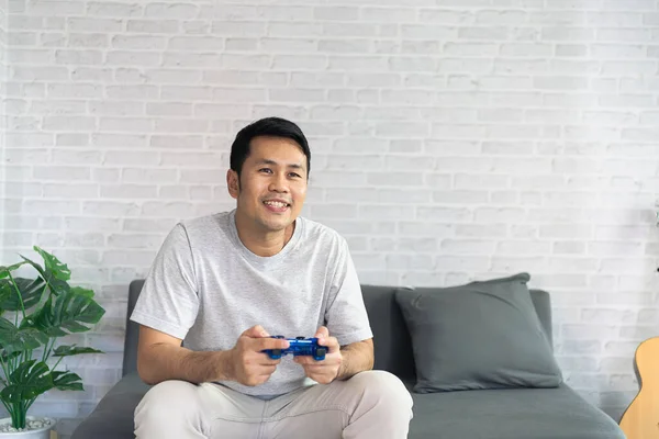 Smiling Asian Man Wearing Casual Clothes Sitting Couch Living Room — Stock Photo, Image