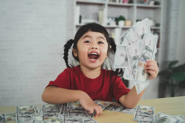 Asian Baby Girl Wearing Red Shirt Holding Dollar Bill Wood — ストック写真