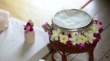Spa massage wellness decorations setting on wood table. Thai spa massage traditional compress for hot massage and spa relaxing treatment of office syndrome. Massage for health concept.