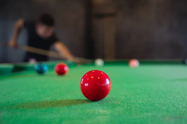 Close up on white and red snooker ball or pool on the snooker table. Snooker player competition snooker game, bet. Indoor snooker sport.